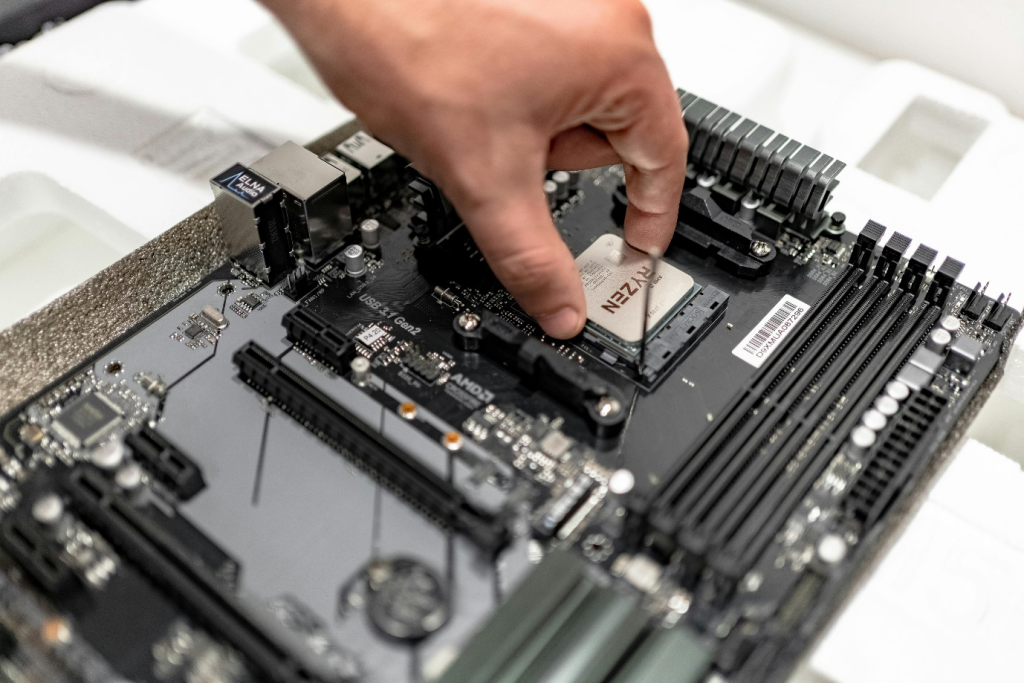 a person fixing a laptop