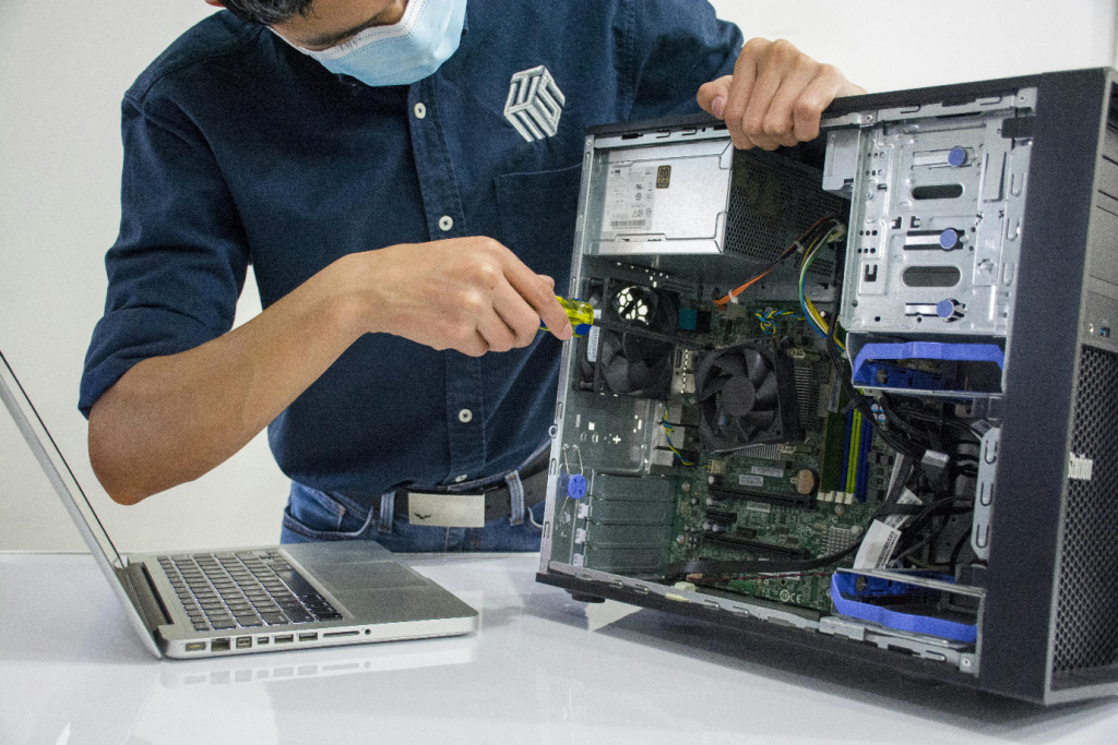 a man repairing a CPU