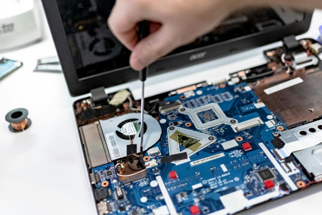 a person fixing a motherboard