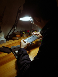 a man repairing a phone