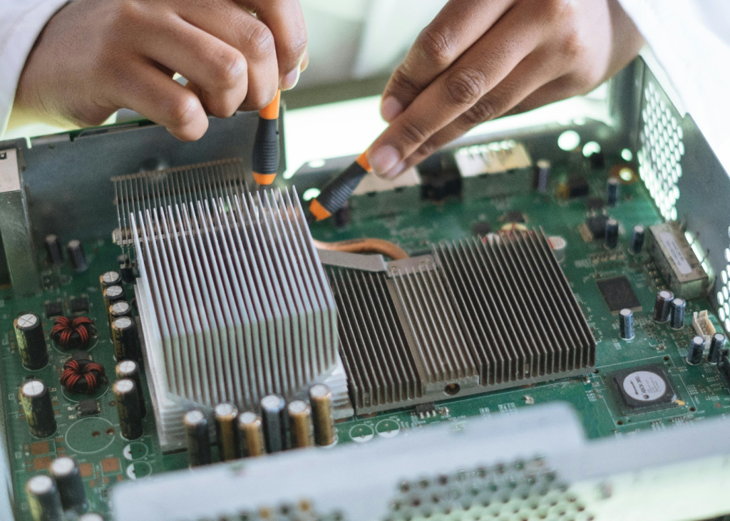 a technician repairing a motherboard