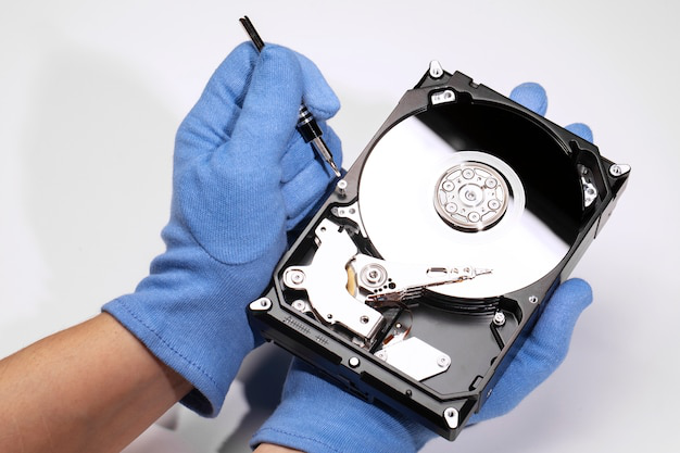 a person holding a hard drive