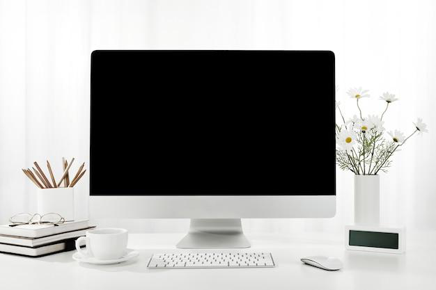 a computer on a white desk