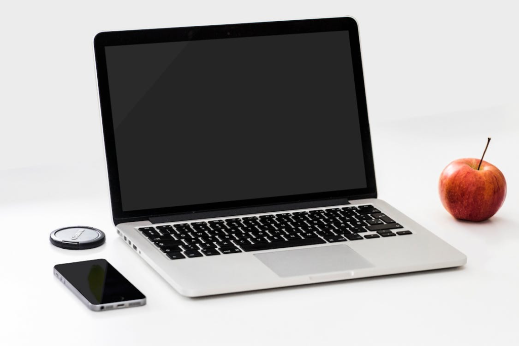 A sleek and slim laptop placed on top of a desk.