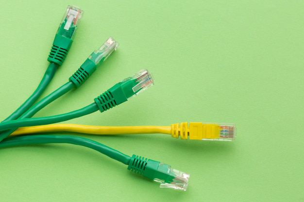 Close-up of organized network cabling under a desk for efficient routing.