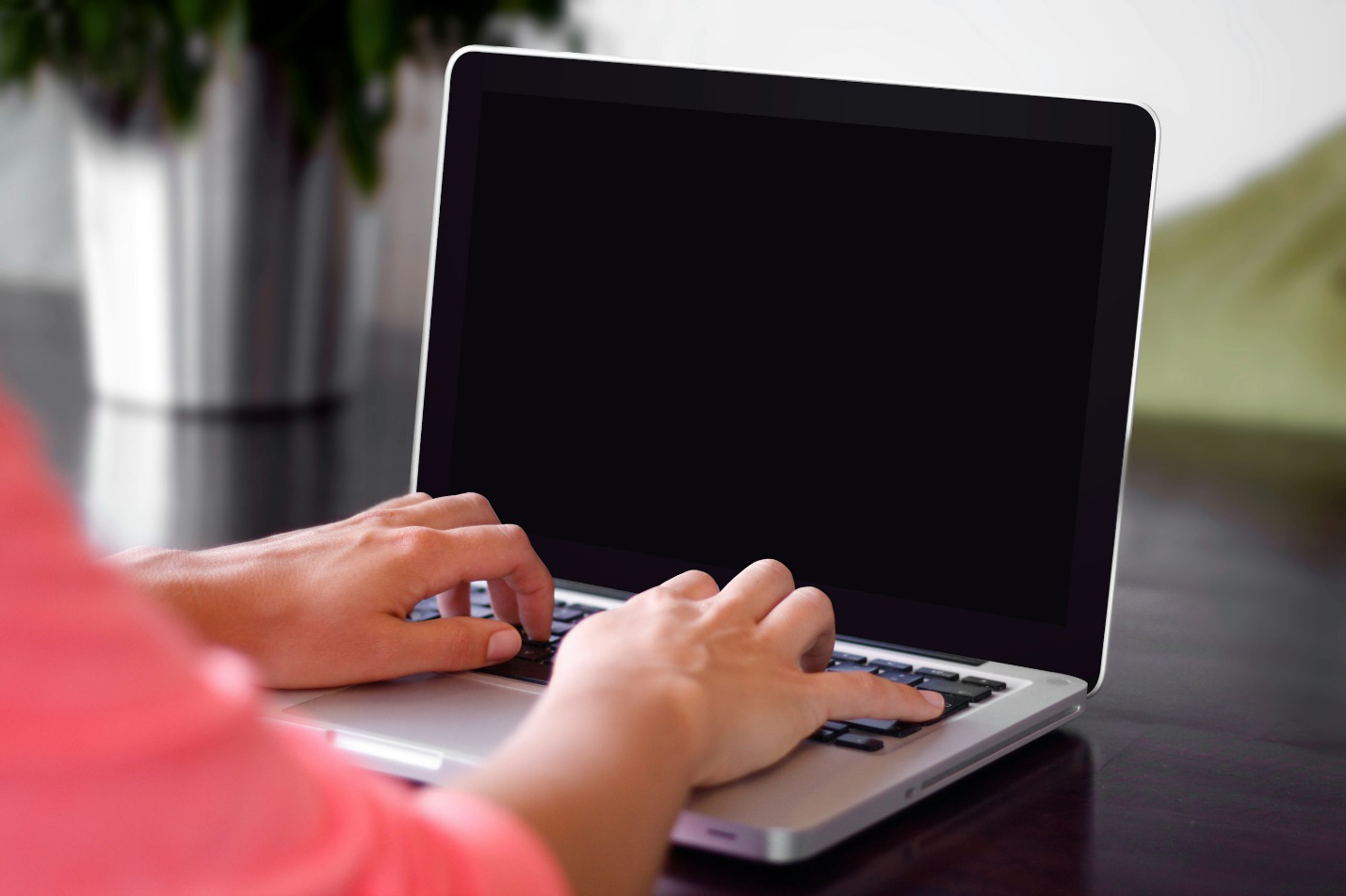 A person working on their laptop.