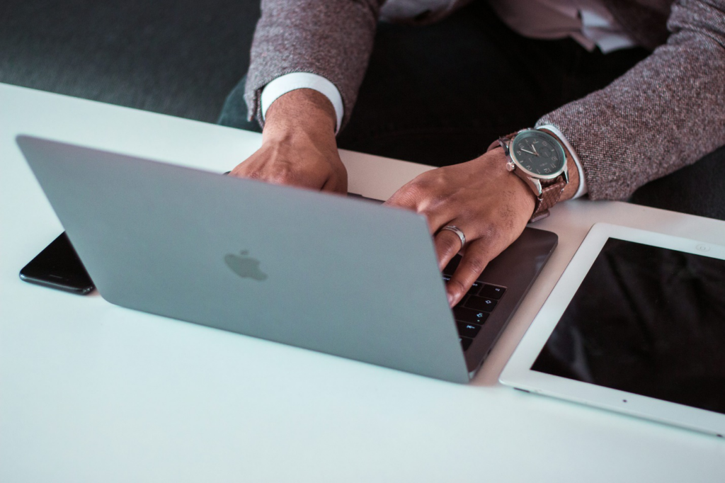 A person typing on their laptop.