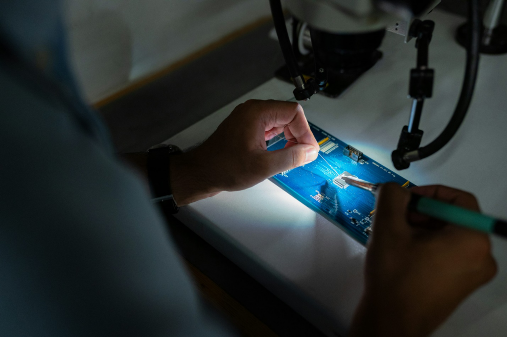 A person fixing a hardware disk.