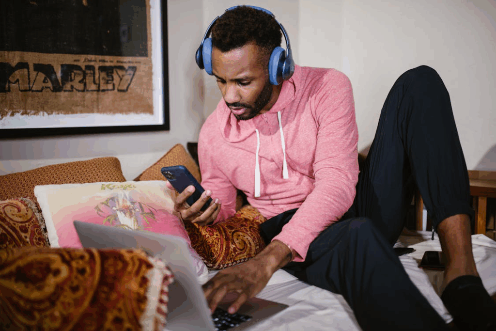 A person using a laptop on the couch