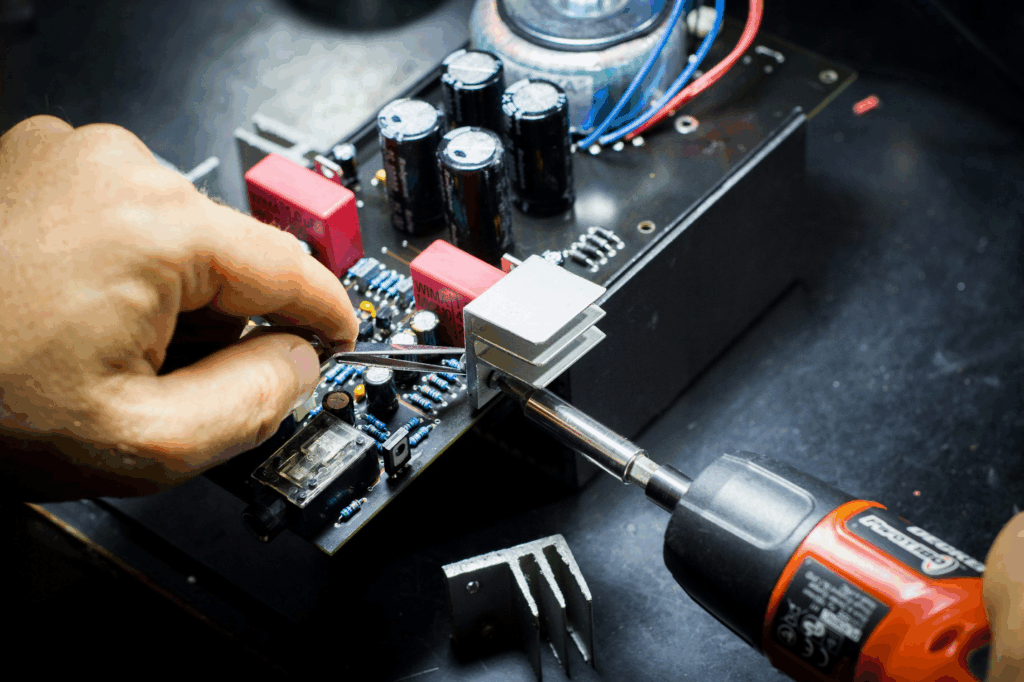 A person repairing a computer. 