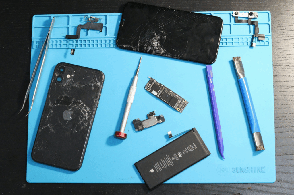 Two phones kept on a table for repairing. 