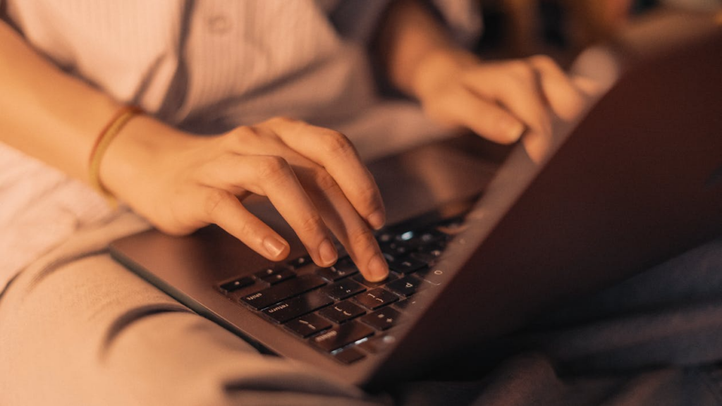 A person working on their laptop.