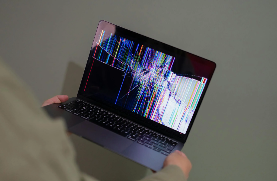 An expert fixing a damaged screen.