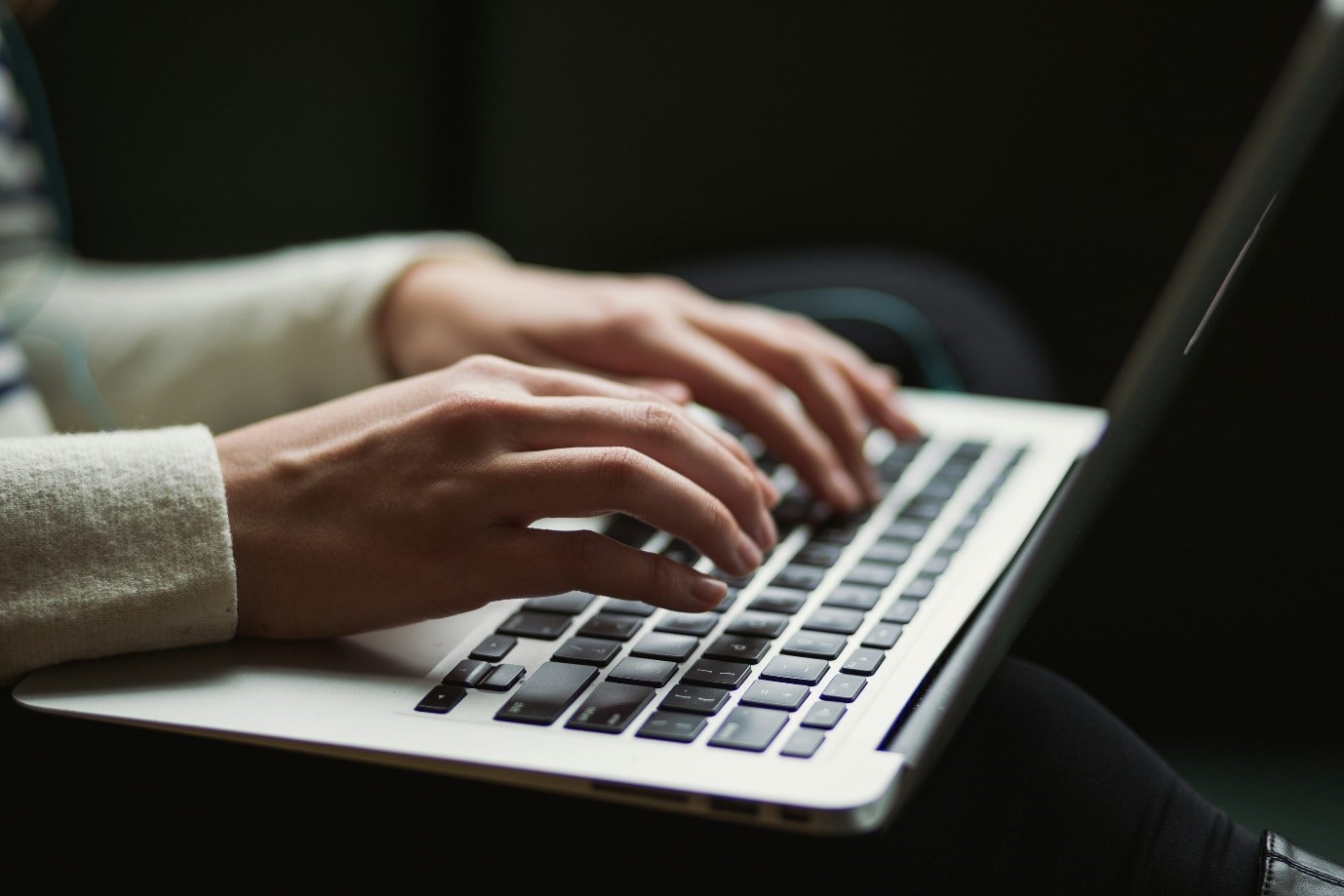 : A technician working on a laptop